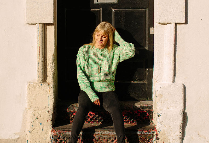 Photograph Of Sarah Rossney sitting on steps